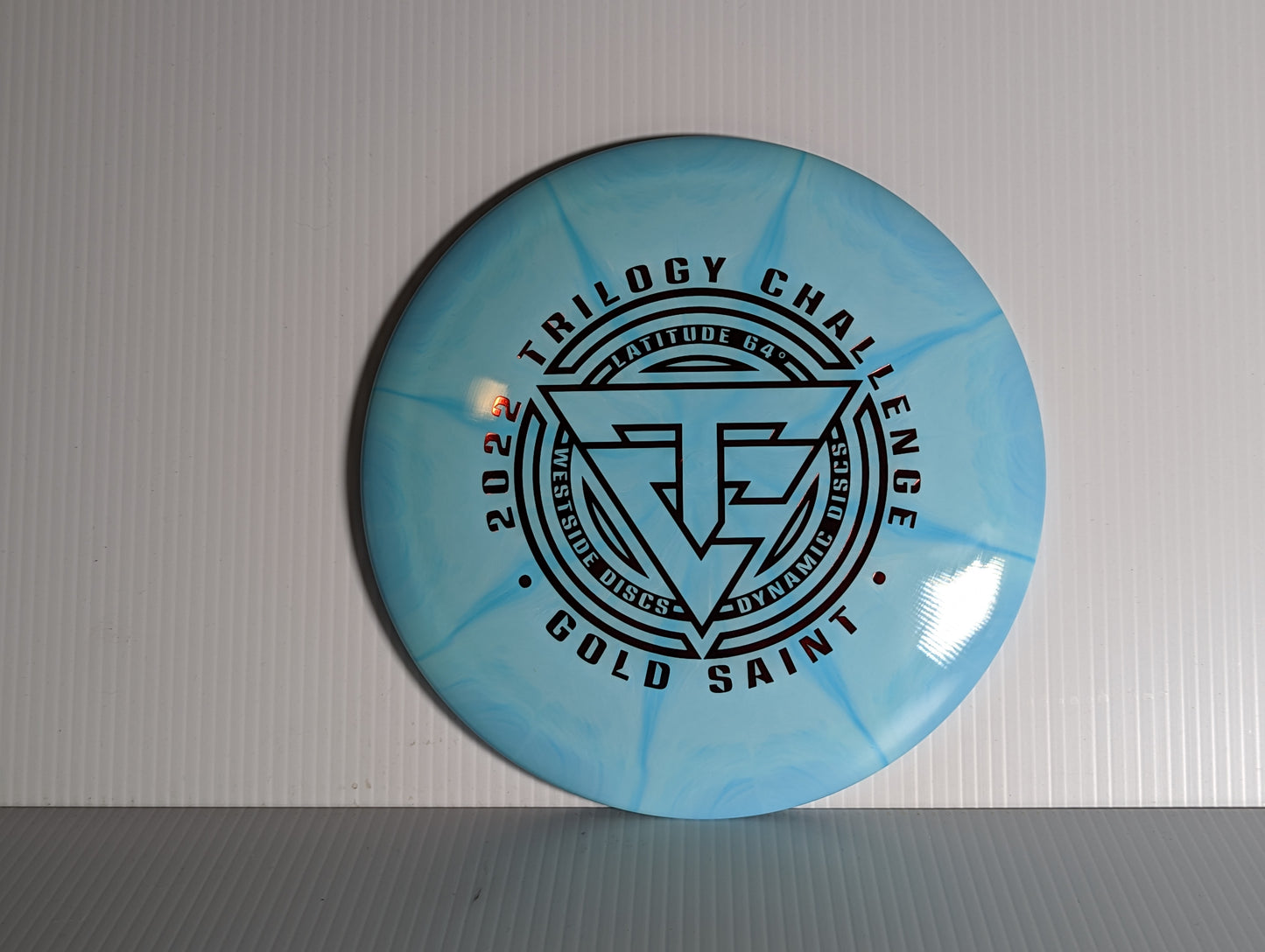 Latitude 64 Gold Burst Saint - 2022 Trilogy Challenge Stamp